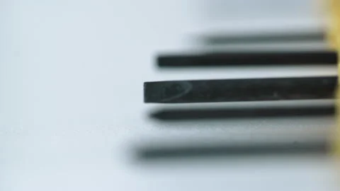 Taking Screwdriver from the table Close up shot, shallow depth of field. Stock Footage 169978984