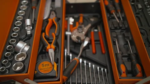 Taking a screwdriver from a toolbox — ready for repair. Stockbeeldmateriaal 312020695