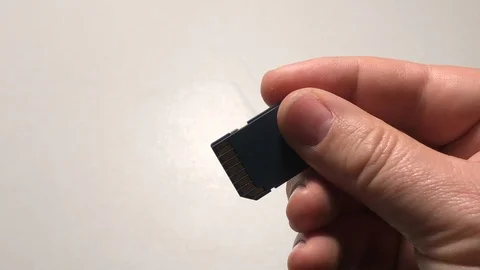 Taking sd card with hand Stock Footage 122102966