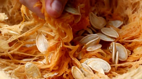 Taking the seeds out of the pumpkin Stock Footage 35521547