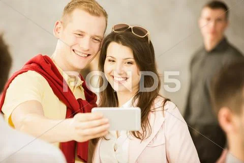 Taking selfie with smartphone Stock Photos