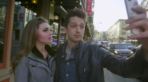 Taking selfies downtown Stock Footage 62465653