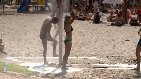 Taking shower on the Beach 2 Stock Footage 22649164
