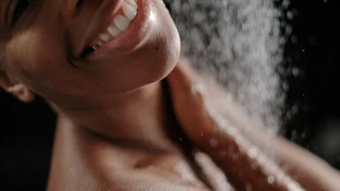 Taking a shower in slow motion Stock Footage