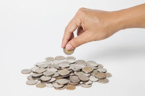 Taking a Silver coin white background Stock Photos