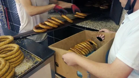 Taking Simit Turkish Bagel out of the oven Video stock 159183206