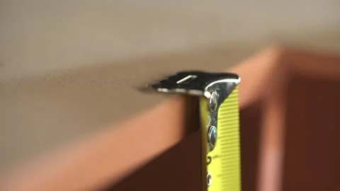 Taking size data of piece from construction by using measuring roulette. Stock Footage 157114689