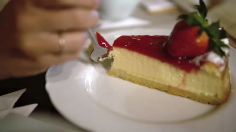 Taking a slice of cheesecake 스톡 동영상 236819469