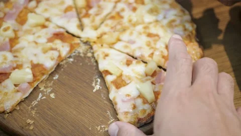 Taking a slice of pizza, Close-up Of People Hands Taking Slices Pizza on wood Video stock 186670971