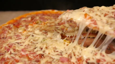 Taking Slice of Pizza with Ham and Mushroom Vídeo Stock 60060463