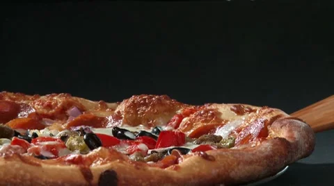 Taking a slice of pizza with a pizza server Video stock 8570848