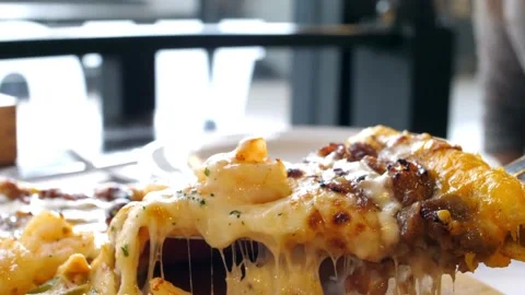 Taking slice of pizza with super stretching cheese apartment to have good time Vídeos de archivo 336586661