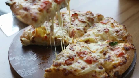 Taking slice of pizza with super stretching cheese apartment to have good time Vídeo Stock 336586664