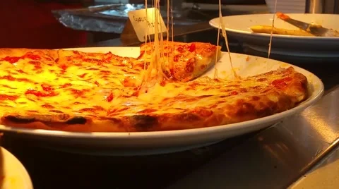 Taking slice of pizza,melted cheese dripping Stock Footage 52432785