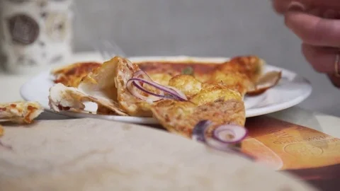 Taking slice of pizza,melted cheese dripping Stockbeeldmateriaal 71250096