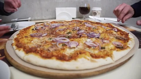 Taking slice of pizza,melted cheese dripping Stockbeeldmateriaal 71250148