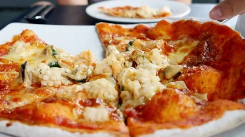 Taking slice of pizza,melted cheese dripping Italian pizza. People and food Vídeos de archivo 336586643