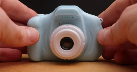 Taking small toy camera away Stock Footage 156859400