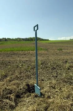 Taking a soil sample on a field Stock Photos