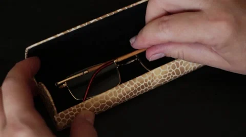 Taking spectacles from a case Vídeos de archivo 66755666