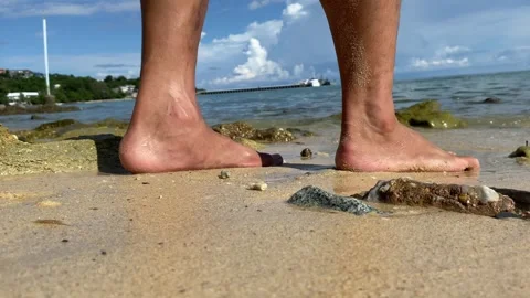 Taking steps walking on wet sandy beach towards the sea outdoor sunny day Stock Footage 281319563