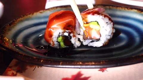 Taking sushi with  chopsticks Stock Footage 269827548