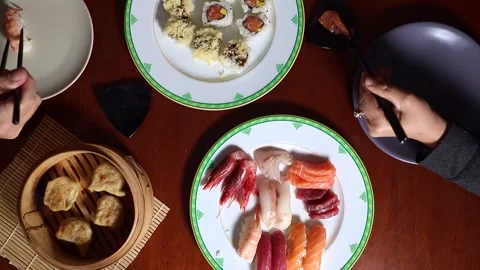 Taking sushi with  chopsticks Stock Footage 269827619