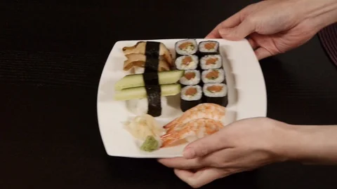 Taking sushi plate Stock Footage 89663649