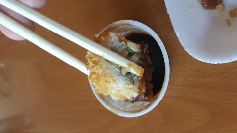 Taking a sushi roll Stock Photos