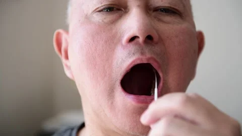 Taking a swab sample for Covid-19 test. Stock Footage 153176021