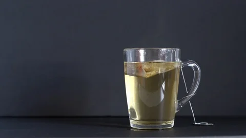 Taking the tea bag out of the cup Stock Footage 121321451