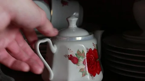 Taking a teapot from a case Stock Footage 63454364