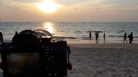 Taking time-lapse with Sony camera over Sunset in Indian Ocean Stock Footage 141548775