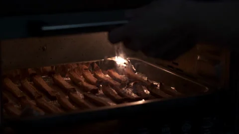 Taking toast bread out of an oven Stock Footage 137431455