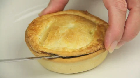 Taking The Top Off A Meat Pie Stock Footage 39454169