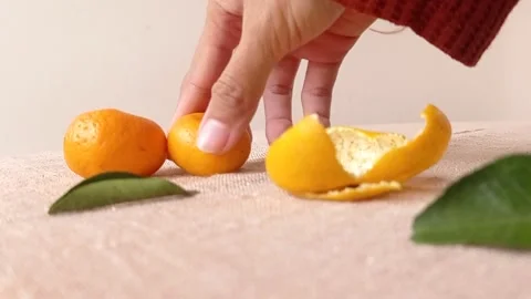 Taking two oranges with hand on the table Stock Footage 149709195