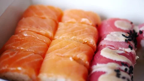 Taking two sushi rolls from delivery box. Stock Footage 70674987