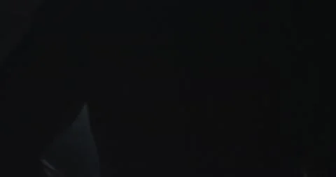 Taking video from the back of athletic guy in a dark cross fit class he started Stock Footage 138105302