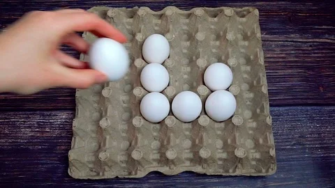 Taking of white chicken egg from egg box 스톡 동영상 107816333