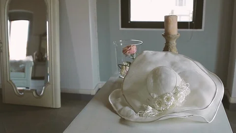 Taking the white hat from the table Video stock 86438528