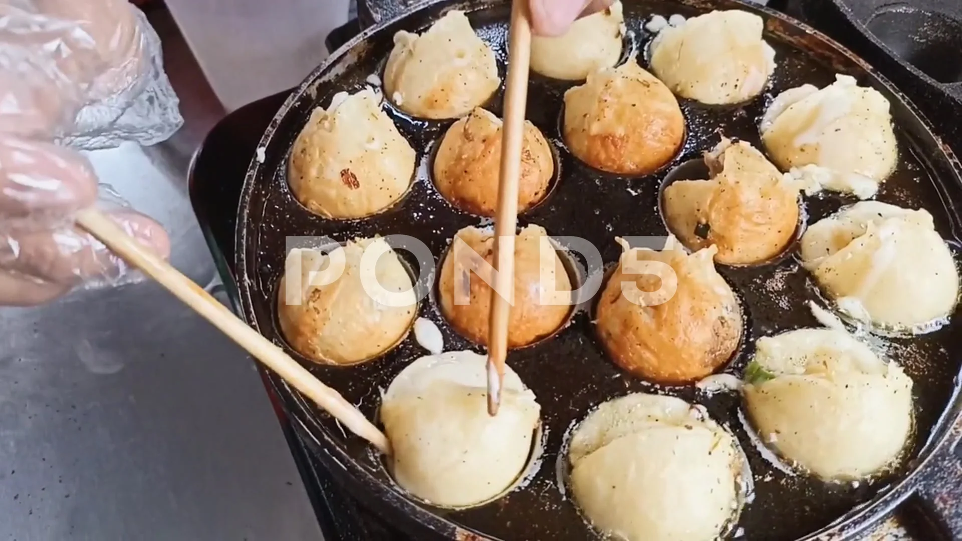 Takoyaki bacooking from above with woode, Stock Video