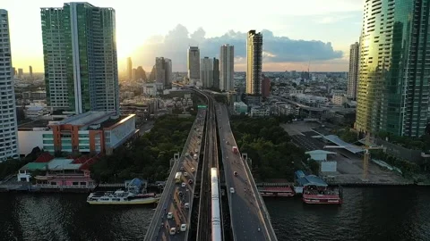 Taksin bridge BTS with epic sun reveal building afternoon Stock-Footage 234041858