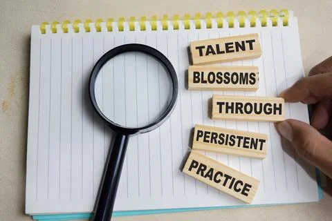 Talent blossoms through persistent practice on stacked wooden cubes Stock Photos