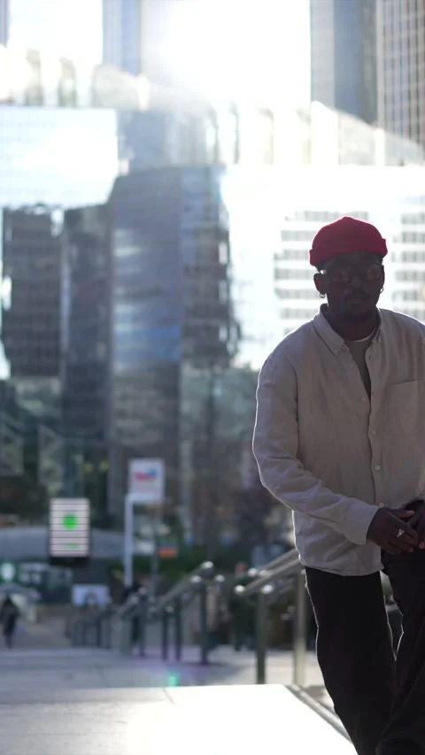 Talented african american man dancing in a sunny city street Stock Footage 323069998
