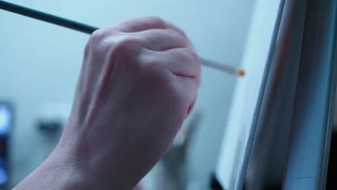 A talented artist draws with a brush on canvas. large view of the hand Stock Footage 146388853