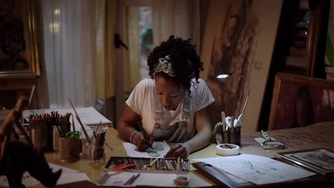 Talented artist draws on canvas, using a pencil creates a portrait painting.  Stock Footage 152345053