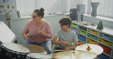 Talented Boy Playing Drums. Teacher Teaching Young Musician to Play Drum Kit on 스톡 동영상 317542385