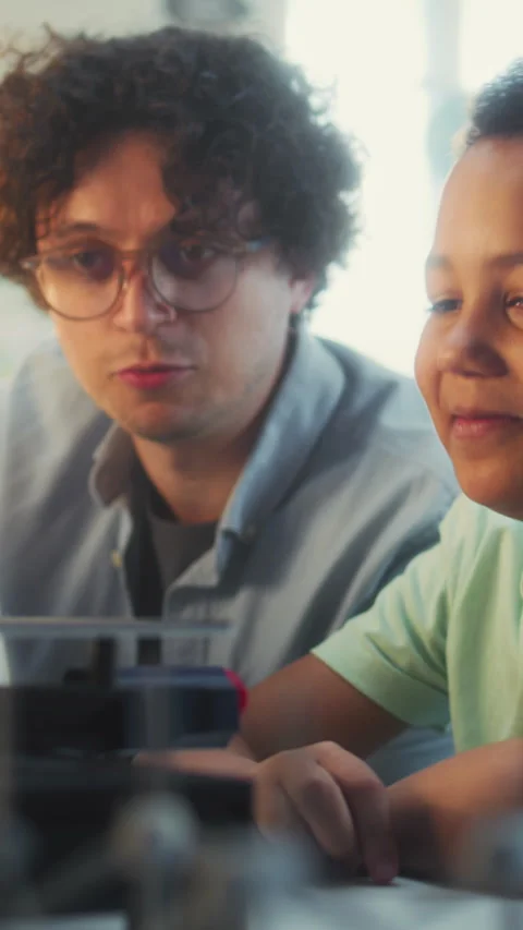Talented Boy Sitting at the Table with Teacher, Studying Printing on Advanced 3D Stock Footage 311806520