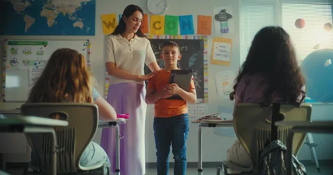 Talented Boy with Tablet Computer Giving Presentation on Ecology in Front of Stock Footage 313961355