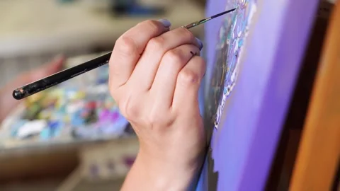 Talented Brunette Artist Captures Creativity While Painting on Canvas Stock Footage 248226237